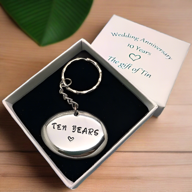 10th Anniversary '10 Years' Tin Pebble Keyring – Vision Arts Tin